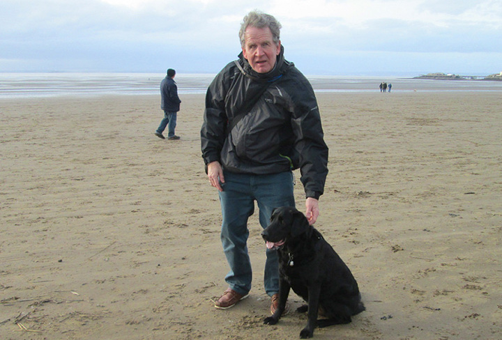 Mike on the Beach with Izzy.jpg